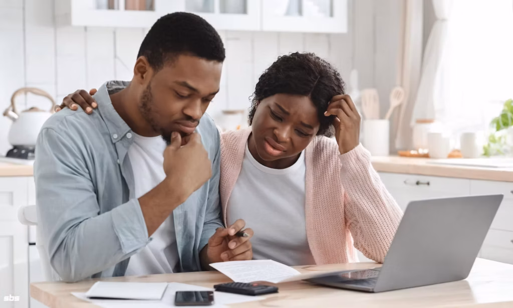 A couple looking at finances together.